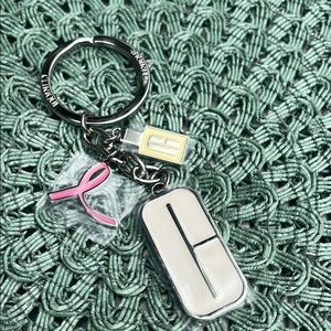 Clinique White and Pink Phone Charm Accessory